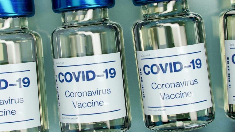 Vials labeled COVID-19 Coronavirus Vaccine with blue caps are arranged side by side, offering all you need to know about the Covid-19 vaccination at a glance. - Meyer Clinic